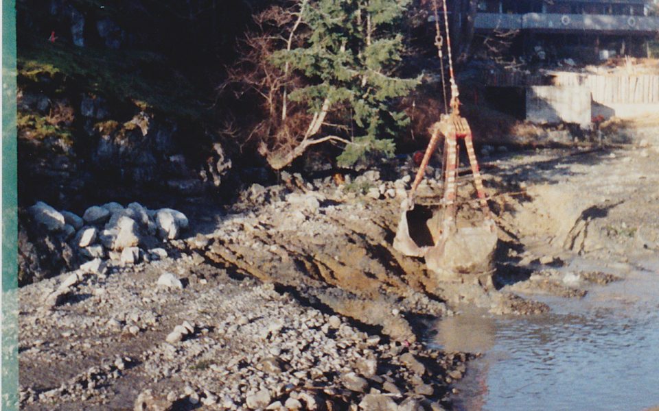 Crane dredging a marina