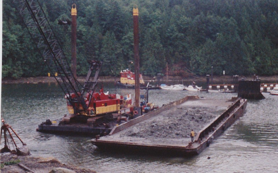 Crane dredging a marina