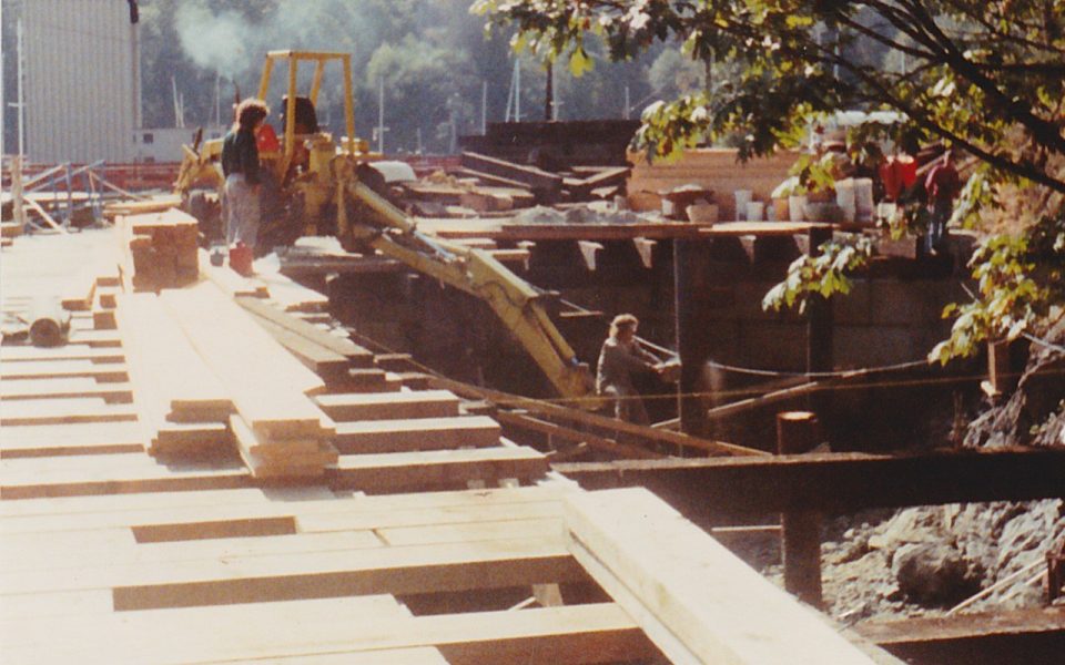Boards being put down connecting a pier to a house