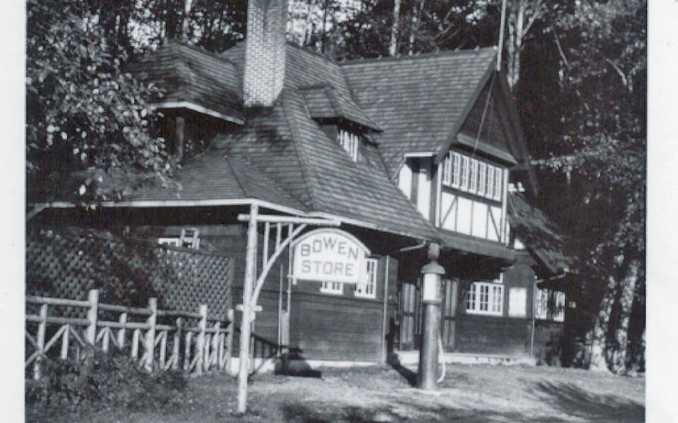 Black and white photo of old building with Bowen Store sign